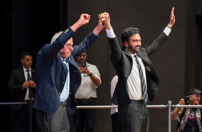 Sen. Bernie Sanders (I-VT) and New York City mayoral candidate Zohran Mamdani greet the crowd during a town hall in New York on Sept. 6. (Olga Fedorova/AP)
