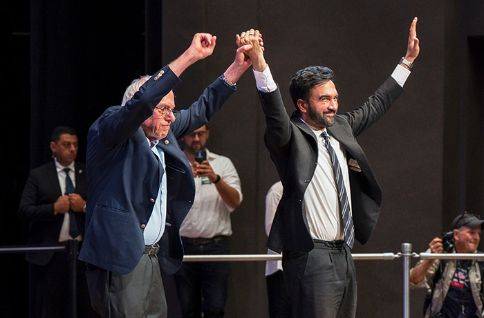 Sen. Bernie Sanders (I-VT) and New York City mayoral candidate Zohran Mamdani greet the crowd during a town hall in New York on Sept. 6. (Olga Fedorova/AP)