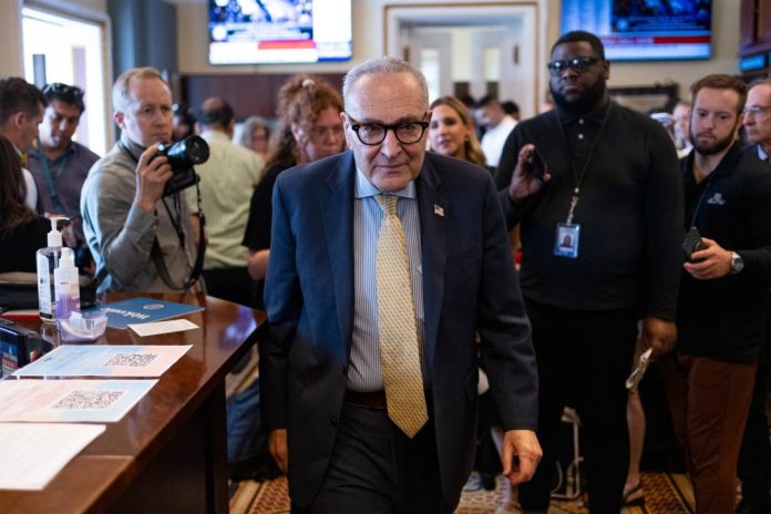 Senate Minority Leader Chuck Schumer (D-NY) leaves a meeting with reporters.