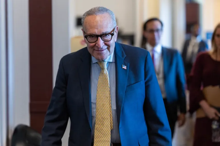 Senate Minority Leader Chuck Schumer (D-NY) heads to a meeting with reporters.