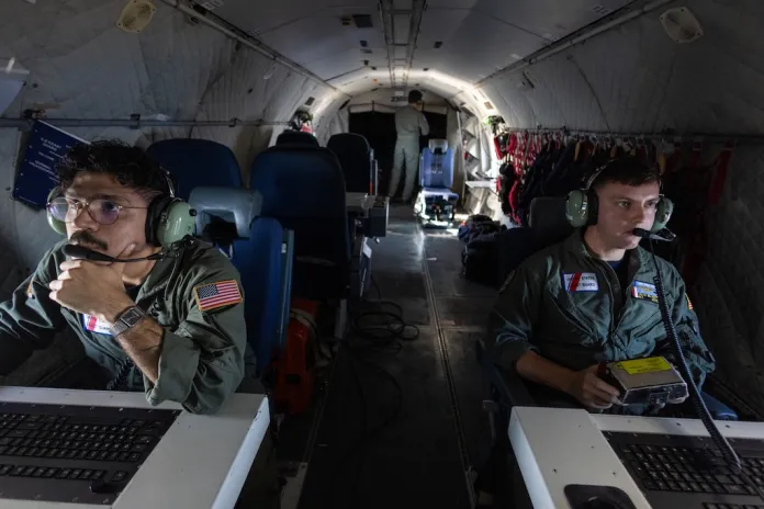 Missions System operator AET3 Caleb McLarty and AET-2 John Montalvo- Valentin onboard a HC-144B Maritime Patrol Aircraft use radar and other technologies to detect illegal fishing activities off the coast of Padre Island, Texas.