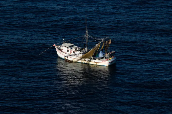 A fishing vessel is seen from onboard a HC-144A Maritime Patrol Aircraft, off the coast of Padre Island Texas.