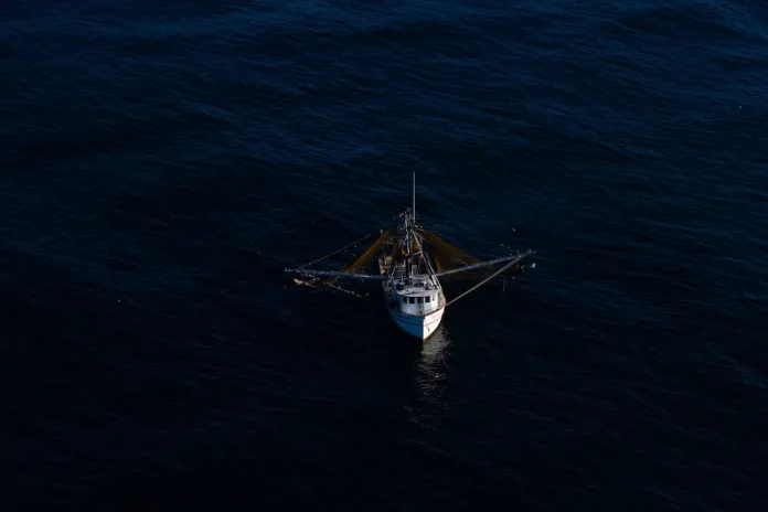 A fishing vessel is seen from onboard a HC-144B Maritime Patrol Aircraft off the coast of Padre Island, Texas.