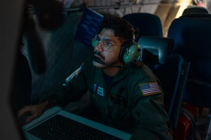 Missions System operator AET-2 John Montalvo-Valentin onboard a HC-144B Maritime Patrol Aircraft uses radar and other technologies to detect illegal fishing activities off the coast of Padre Island, Texas.