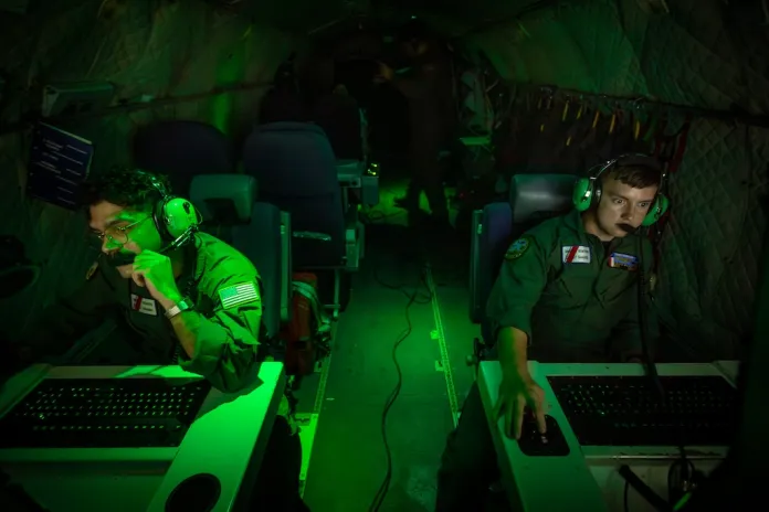 Missions System operator AET3 Caleb McLarty and AET-2 John Montalvo- Valentin onboard a HC-144A Maritime Patrol Aircraft, use radar and other technologies to detect illegal fishing activities off the coast of Padre Island Texas.