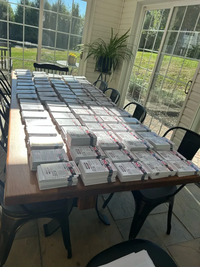 Stacks of nearly 10,000 postcards going to Amish voters who made an impact in the 2024 elections in Pennsylvania for president, Senate, all three statewide, elected row offices, and two congressional races.