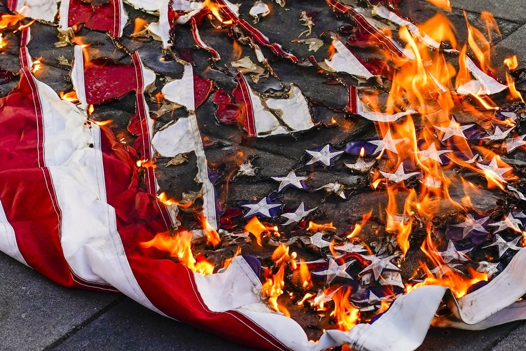 NextImg:Trump advises that anyone burning American flag will be imprisoned for a year