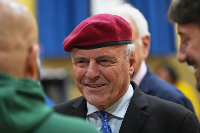 New York City mayoral candidate Curtis Sliwa speaks to people at a voting location inside Trinity Lutheran Church Tuesday, Oct. 28, 2025, in the Queens borough of New York. (AP Photo/Frank Franklin II)