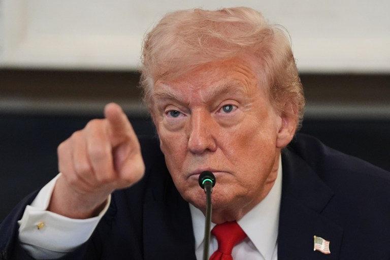 Donald Trump points to something