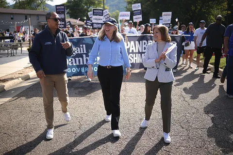 Virginia Democratic gubernatorial candidate, former Rep. Abigail Spanberger (C), marches in the 54th Annual Buena Vista Labor Day Festival parade with Democratic Nominee for Lieutenant Governor, Senator Ghazala Hashmi (R), and Democratic Nominee for Attorney General, former state Delegate Jay Jones (L).