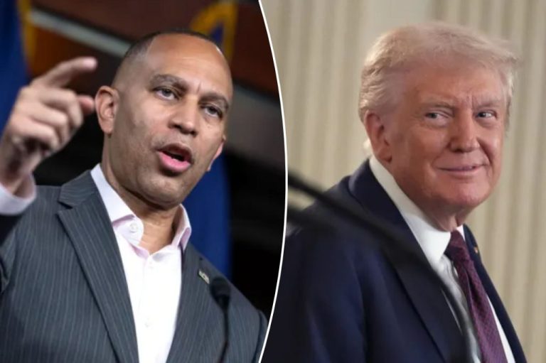 Hakeem Jeffries points next to a photo of Donald Trump smiling