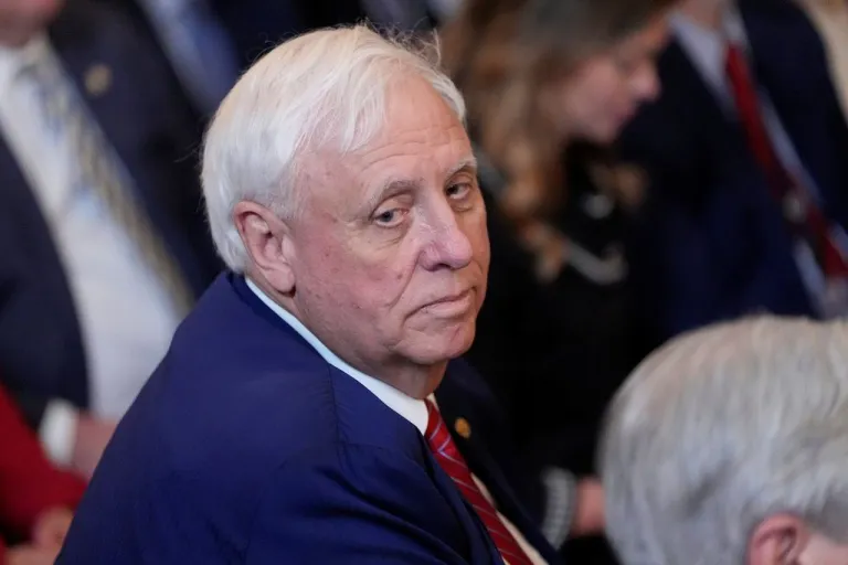 Jim Justice looks on at a Trump speech this year.