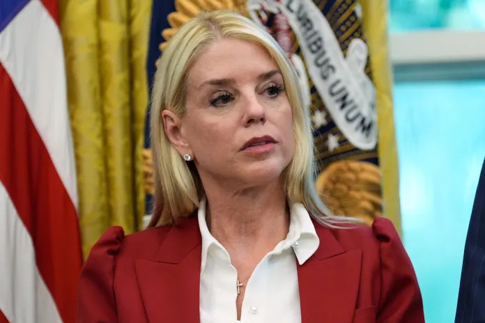 Bondi looks on in the Oval Office.