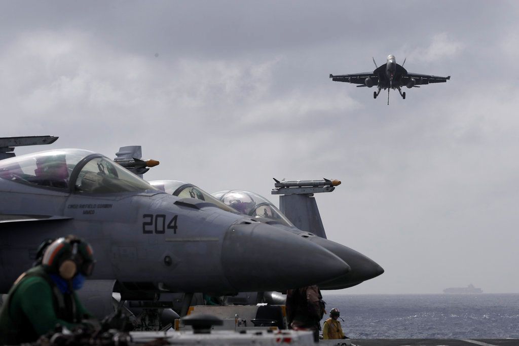 US Navy fighter jet and helicopter crash in South China Sea