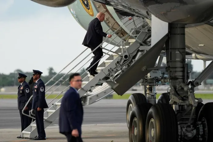 Trump boards Air Force One using small stairs after hunting stand found at airport