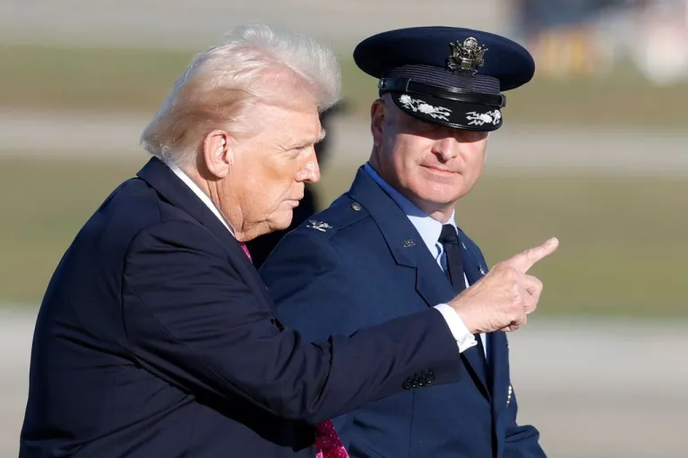 Trump points in the distance.