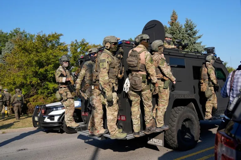 Federal agents are seen outside the Broadview ICE facility.