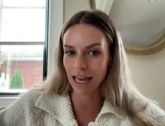 woman sitting in front of window