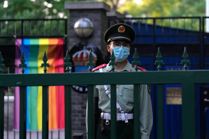 A Chinese paramilitary policeman stands guard outside the Swedish Embassy.