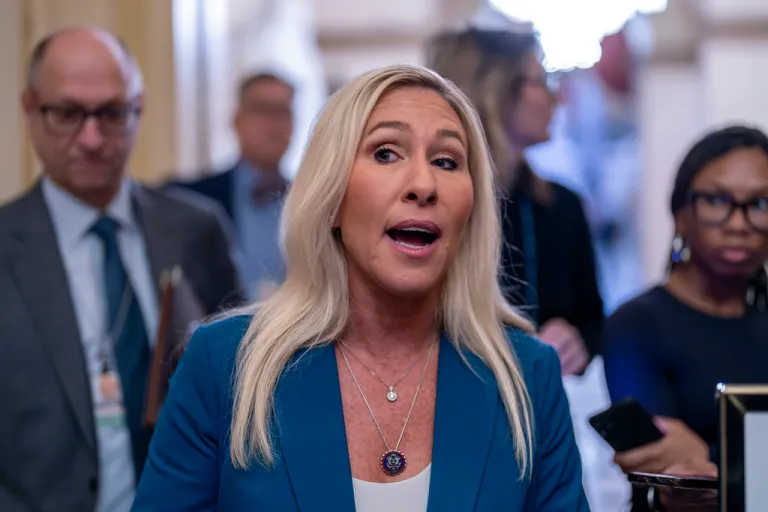 Marjorie Taylor Greene in front of a crowd.