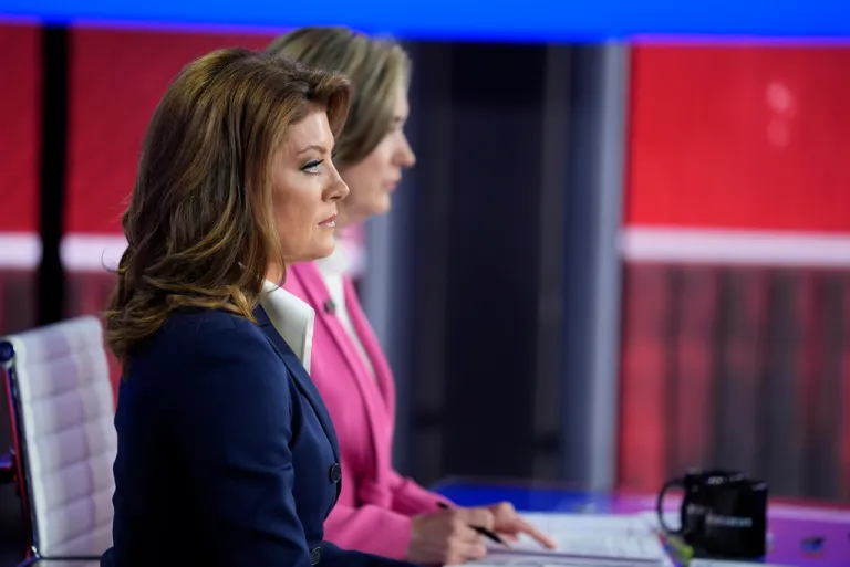 Moderators Norah O'Donnell and Margaret Brennan listen as Republican vice presidential nominee Sen. JD Vance (R-OH), speaks during a vice presidential debate.