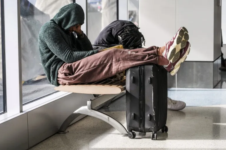 People sleep at Los Angeles International Airport.
