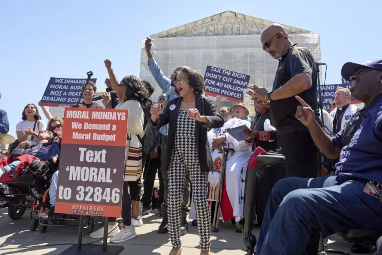 Activists with the Poor People's Campaign led by Rev. William Barber protest against spending reductions across Medicaid, food stamps and federal aid in President Donald Trump's spending and tax bill being worked on by Senate Republicans this week, outside the Supreme Court in Washington, Monday, June 2, 2025.