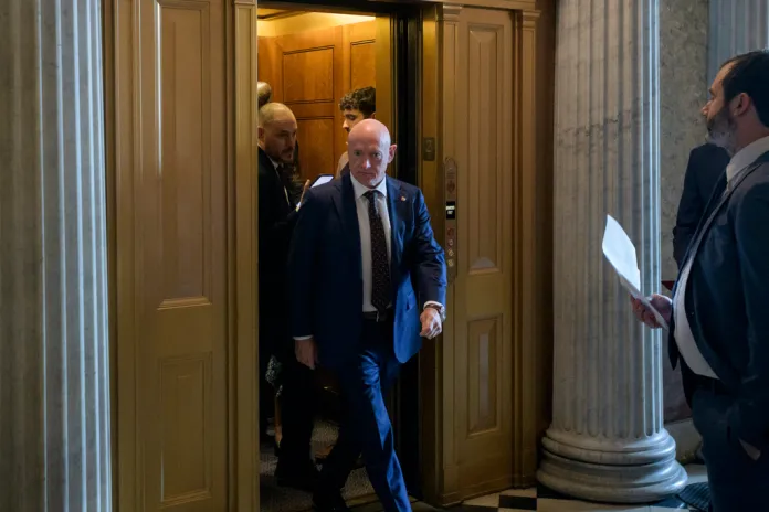 Sen. Mark Kelly, D-Ariz., walks to the Senate chamber as Senate Republicans vote on President Donald Trump's request to cancel about $9 billion in foreign aid and public broadcasting spending, at the Capitol in Washington, Wednesday, July 16, 2025.