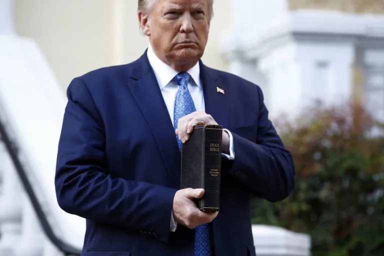 President Donald Trump holds a Bible.