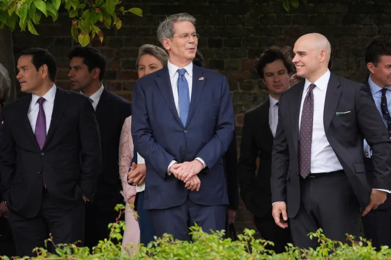 From left, Secretary of State Marco Rubio, Treasury Secretary Scott Bessent and White House Deputy Chief of Staff James Blair wait before a display by the British Parachute Regiment's 