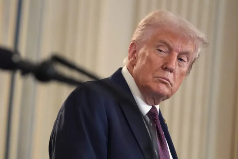 President Donald Trump listens during a news conference.
