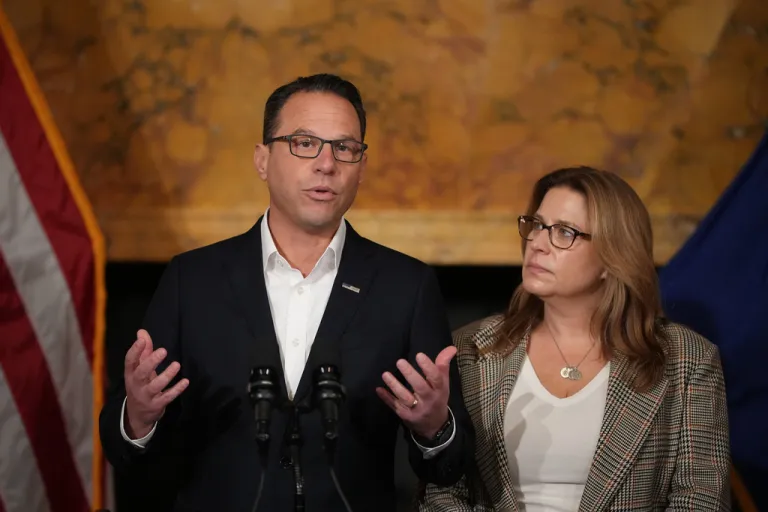 Pennsylvania Gov. Josh Shapiro, accompanied by his wife Lori Shapiro, speaks during a news conference after Cody Balmer plead guilty to attempted murder and other charges, on Tuesday, Oct. 14, 2025 in Harrisburg, Pa.
