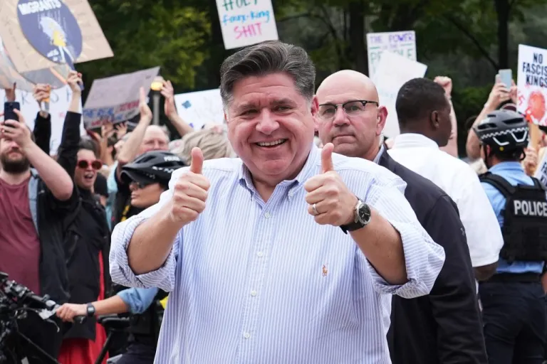 JB Pritzker, arrives during a 