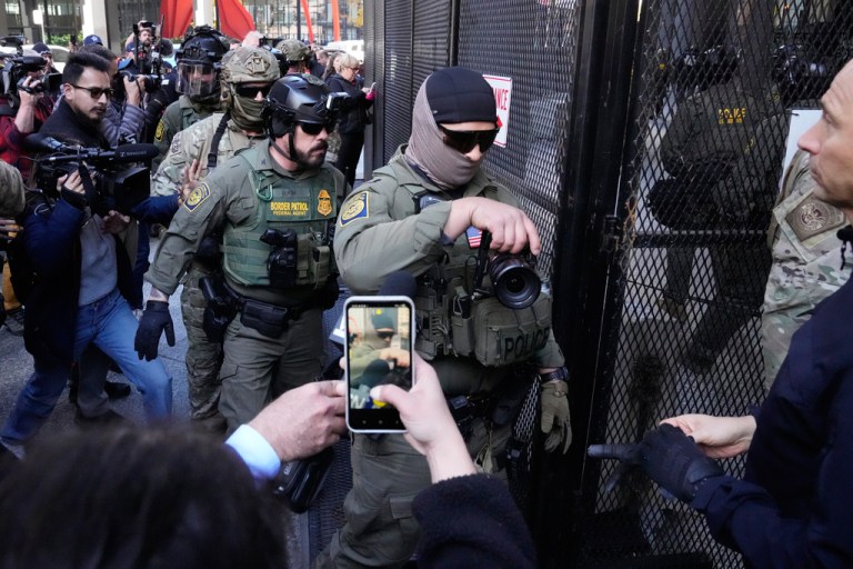 U.S. Customs and Border Patrol agents arrive to escort U.S. Customs and Border Patrol Gregory Bovino from federal court in Chicago, Tuesday, Oct. 28, 2025. (AP Photo/Nam Y. Huh)