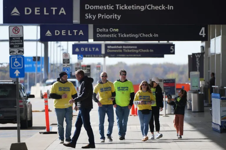 Air Traffic Controllers distribute leaflets.