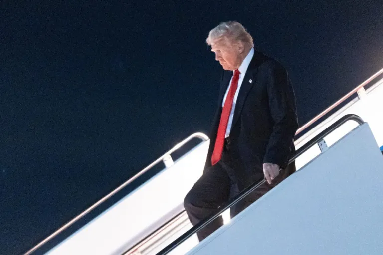 President Donald Trump deplanes Air Force One.