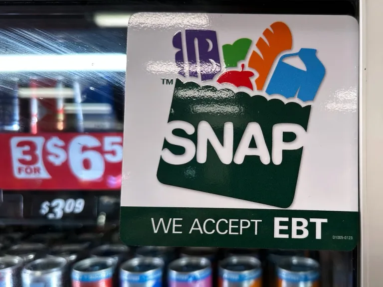 SNAP EBT information sign is displayed at a gas station.