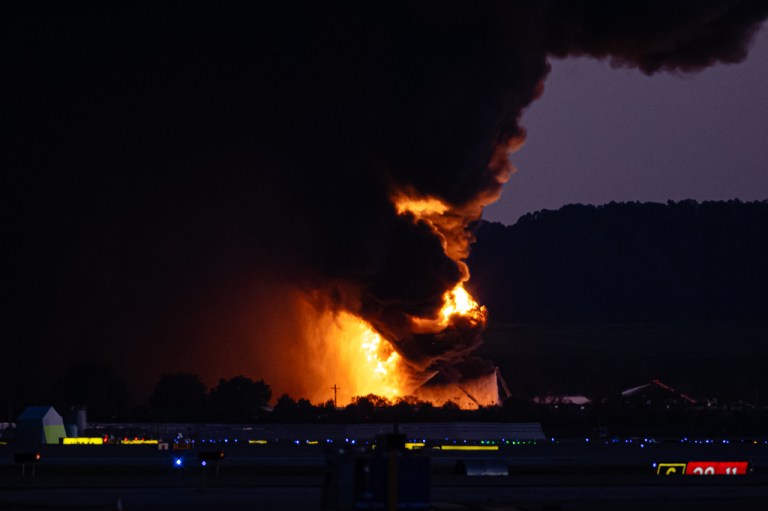 A fireball erupts near airport property after reports of a plane crash
