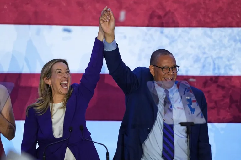 New Jersey Democratic Gov. elect Mikie Sherrill and Lt. Gov. elect Dale Caldwell celebrate during an election night party in East Brunswick, N.J., Tuesday, Nov. 4, 2025. (AP Photo/Matt Rourke)