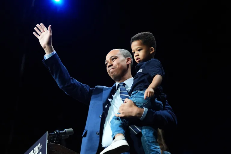 Democrat Jay Jones waves to the crowd on stage at an election night watch party for Democrat Abigail Spanberger after Jones was declared the winner of the Virginia attorney general's race Tuesday, Nov. 4, 2025, in Richmond, Va. (AP Photo/Stephanie Scarbrough)