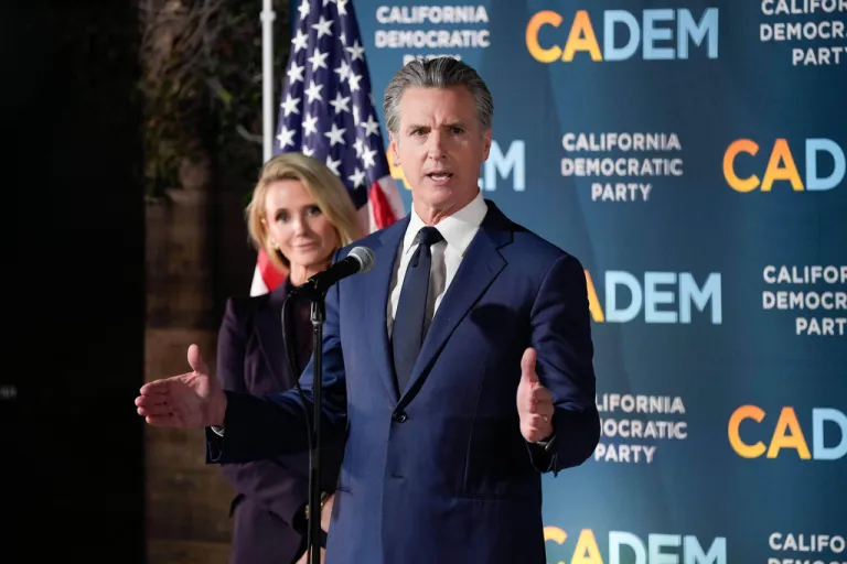 Gavin Newsom stands with first partner Jennifer Siebel Newsom as he speaks during an election night press conference at a California Democratic Party office Tuesday, Nov. 4, 2025, in Sacramento, Calif. (AP Photo/Godofredo A. Vásquez)
