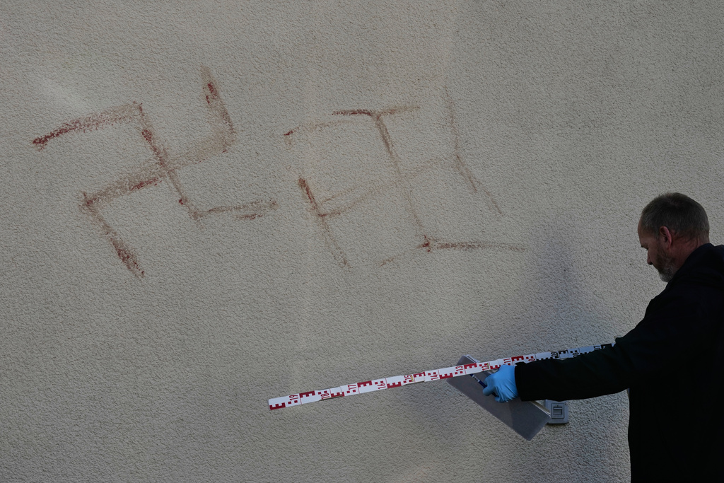 Dozens of swastikas painted in human blood daubed on property across German city