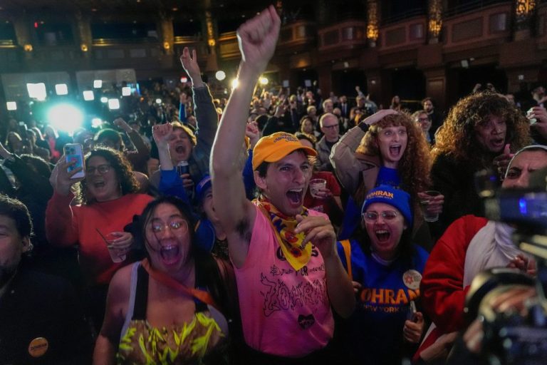 Supporters of Democratic mayoral nominee Zohran Mamdani cheer as they watch returns during an election night watch party.