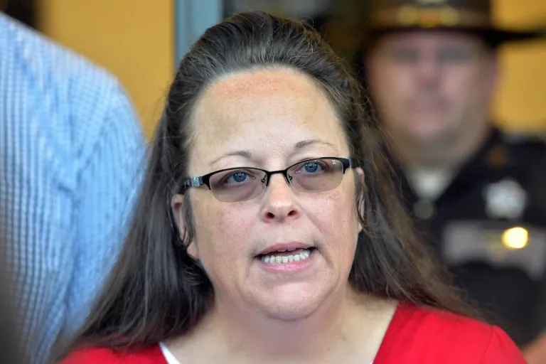 FILE - Rowan County Clerk Kim Davis makes a statement to the media at the front door of the Rowan County Judicial Center in Morehead, Ky. Sept. 14, 2015. (AP Photo/Timothy D. Easley, File)