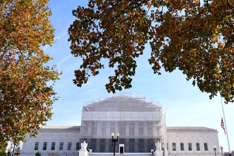 The Supreme Court framed by trees.