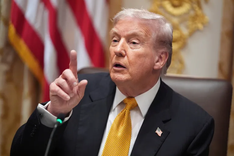 President Donald Trump speaks with reporters.