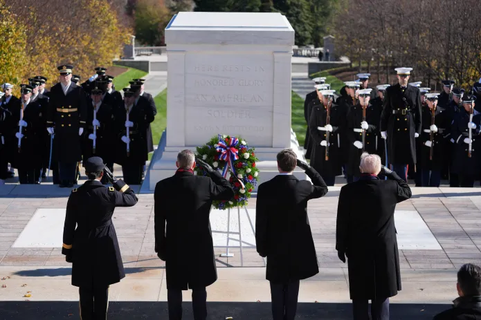 President Donald Trump, right, salutes during a wreath laying ceremony at the Tomb of the Unknown Soldier at Arlington National Cemetery, Tuesday, Nov. 11, 2025, in Arlington, Va. (AP Photo/Evan Vucci)