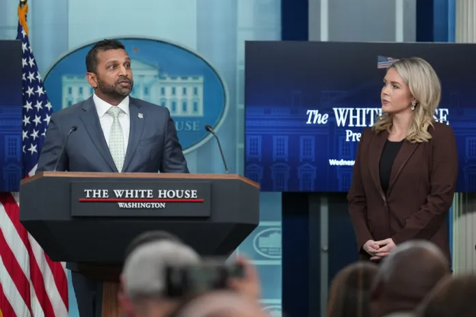 White House press secretary Karoline Leavitt listens to FBI Director Kash Patel speak to reporters