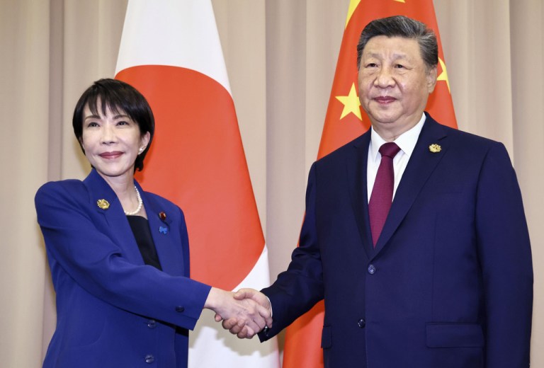 Takaichi shakes hands with Xi