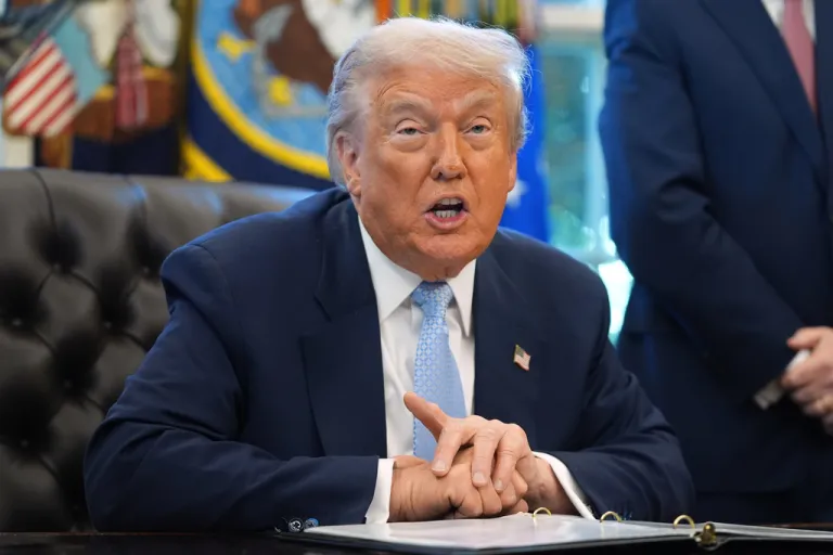 President Donald Trump speaks during a meeting in the Oval Office.